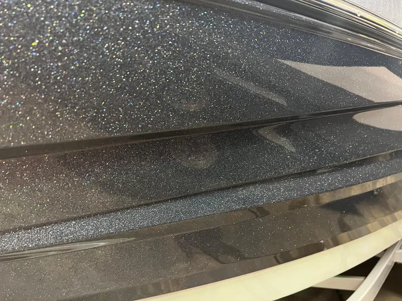 Slide: The Image of 2024 Supreme S220 boat with sparkling metallic finish. - 24
