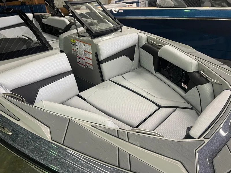Slide: The Image of 2024 Supreme S220 boat interior with sleek, modern seating design. - 26
