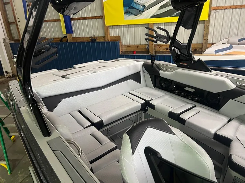 Slide: The Image of 2024 Supreme S220 boat interior with sleek, modern seating and advanced dashboard features. - 27