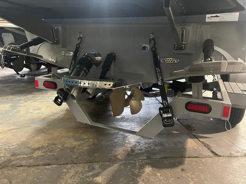 Slide: The Image of 2024 Supreme S220 boat stern with propeller and trailer attachments. - 32
