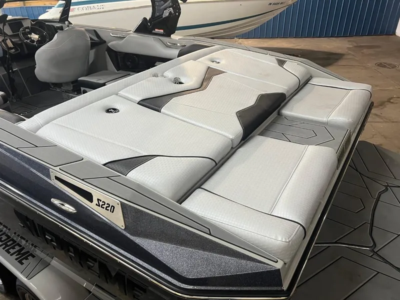 Slide: The Image of 2024 Supreme S220 boat interior with sleek, modern seating design. - 35