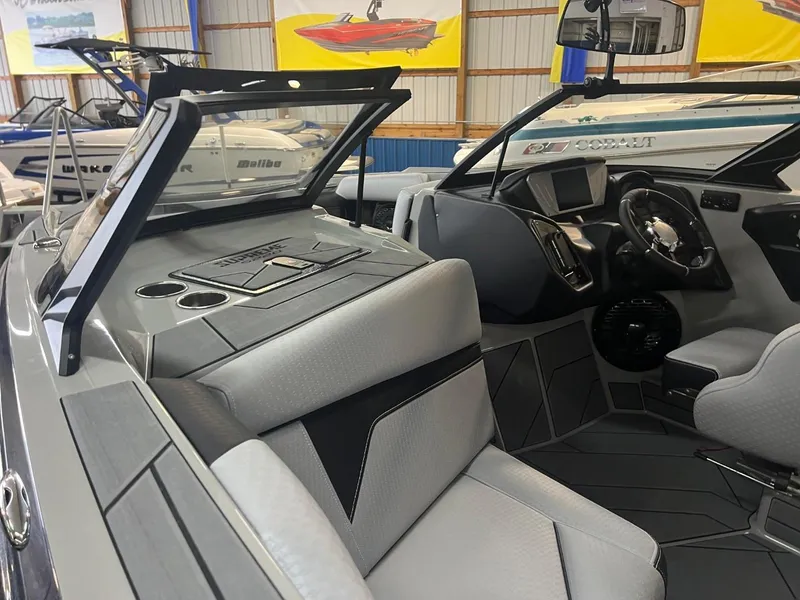 Slide: The Image of 2024 Supreme S220 boat interior with modern dashboard and seating. - 38