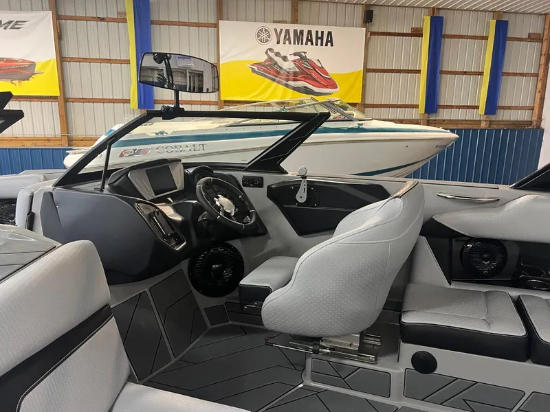 Slide: The Image of 2024 Supreme S220 boat interior with modern dashboard and seating. - 39