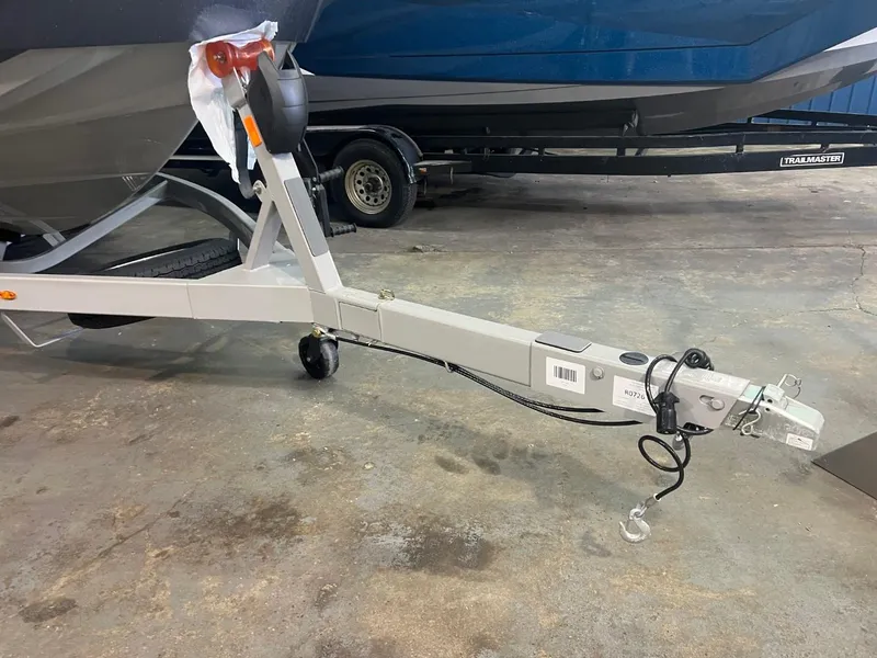 Slide: The Image of 2024 Supreme S220 boat trailer hitch in a garage setting. - 45