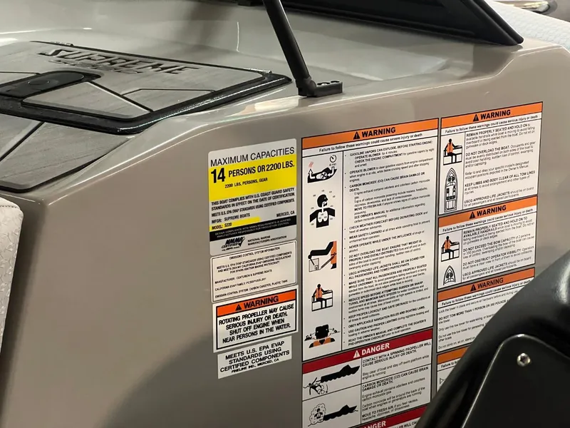 Slide: The Image of 2024 Supreme S220 boat safety and capacity labels, maximum 14 persons or 2200 lbs. - 46