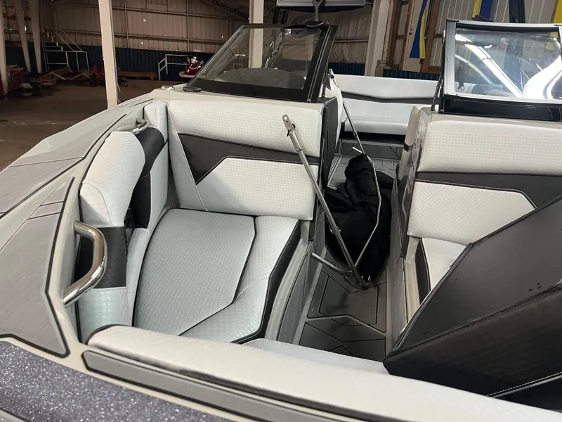 Slide: The Image of 2024 Supreme S220 boat interior with sleek, modern seating and stylish design. - 6