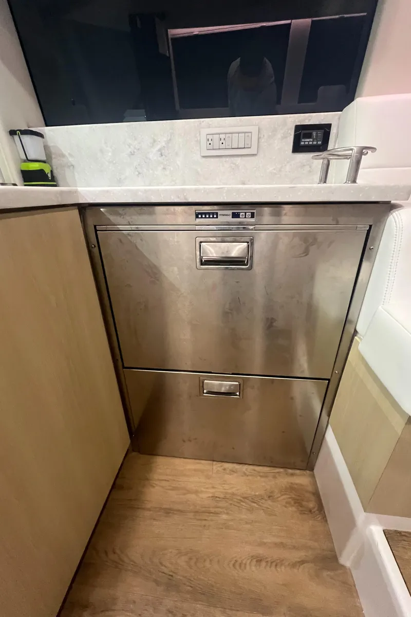 Slide: The Image of Stainless steel kitchen appliance in 2023 Regal 38 XO yacht interior. - 15