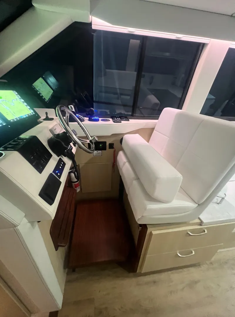 Slide: The Image of 2023 Regal 38 XO helm with modern controls and comfortable seating. - 21