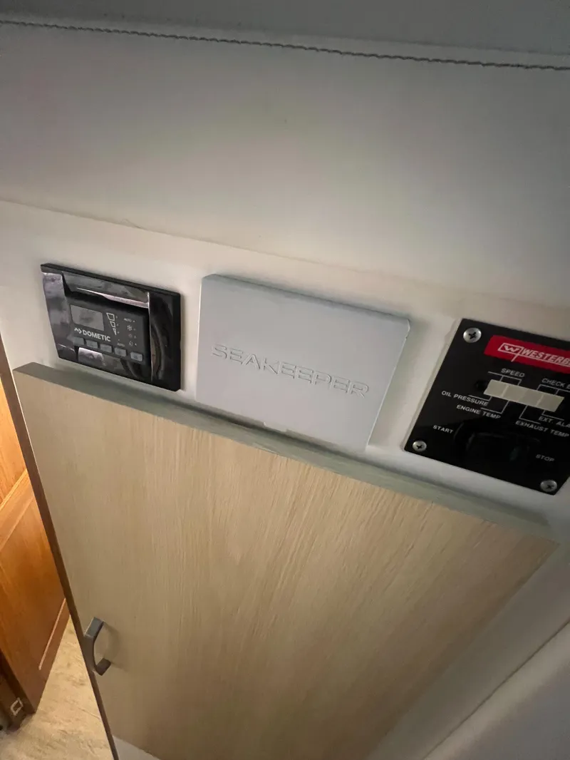 Slide: The Image of 2023 Regal 38 XO interior control panel with Shakespeare and Onan components. - 25