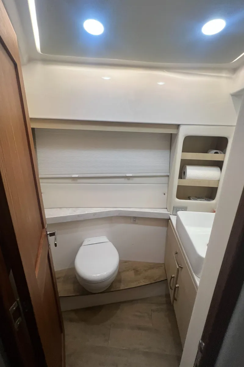 Slide: The Image of 2023 Regal 38 XO yacht bathroom with modern fixtures and lighting. - 27