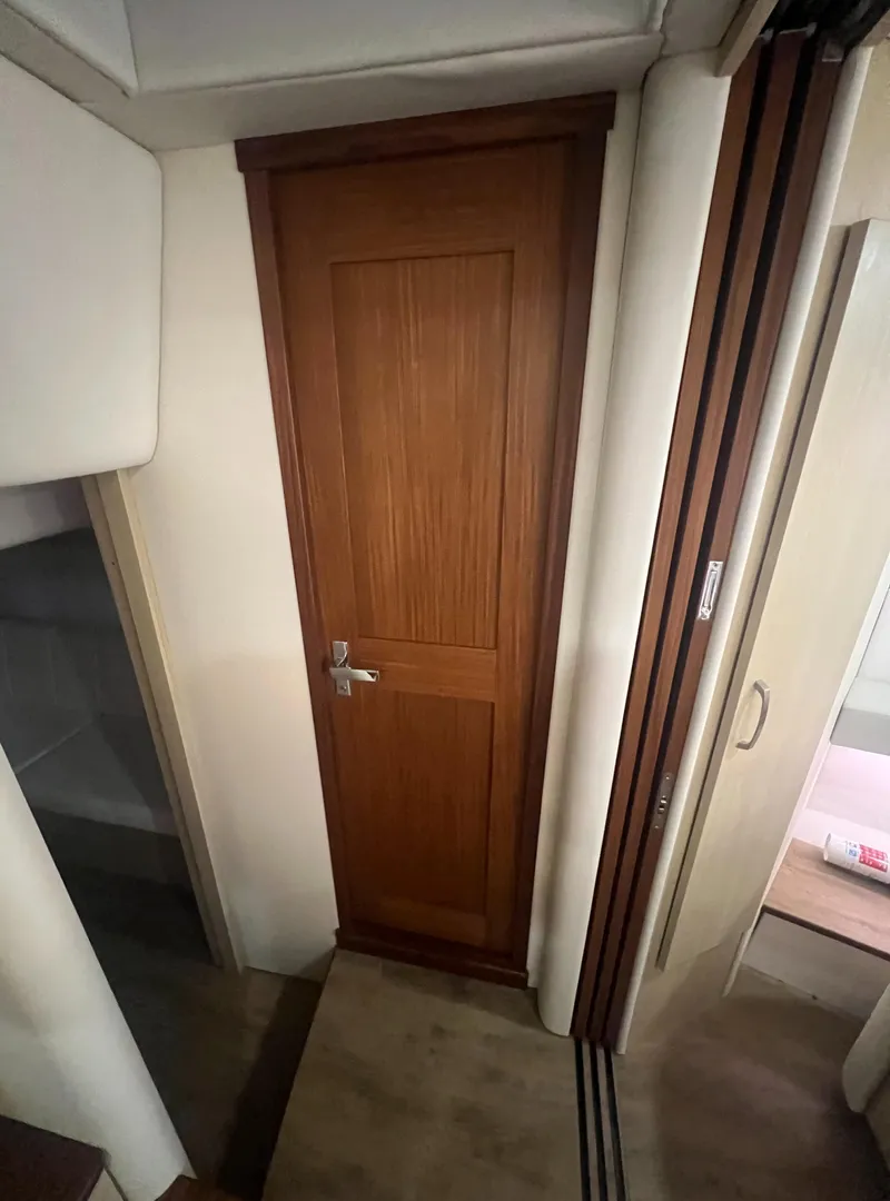 Slide: The Image of Interior of 2023 Regal 38 XO yacht with wooden door and modern design. - 31