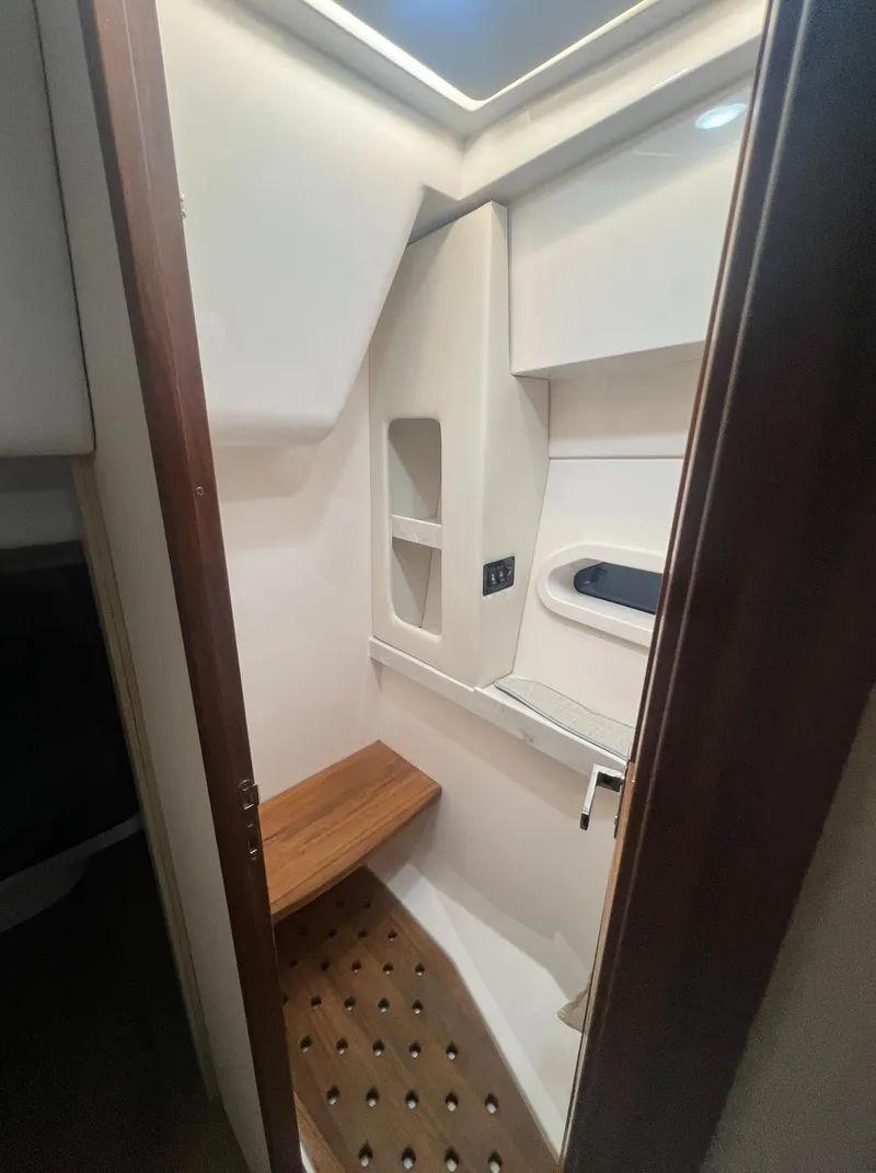 Slide: The Image of 2023 Regal 38 XO yacht interior bathroom with modern design and wooden accents. - 32