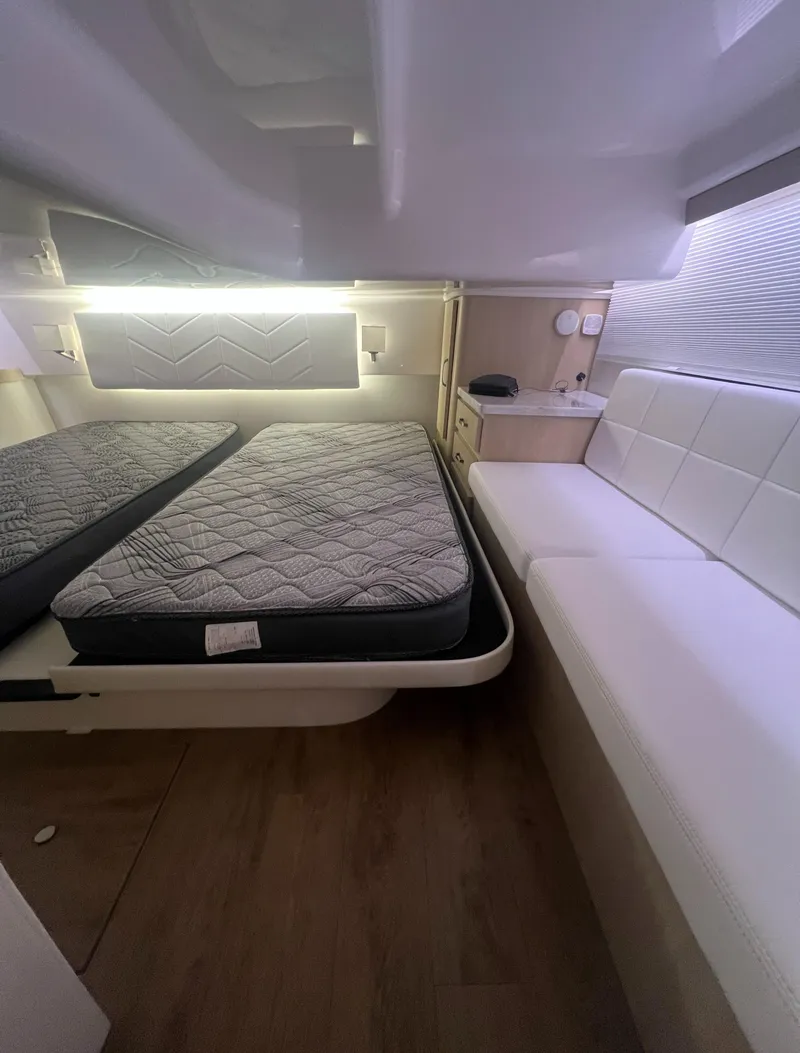 Slide: The Image of 2023 Regal 38 XO cabin interior with bed and seating area. - 33