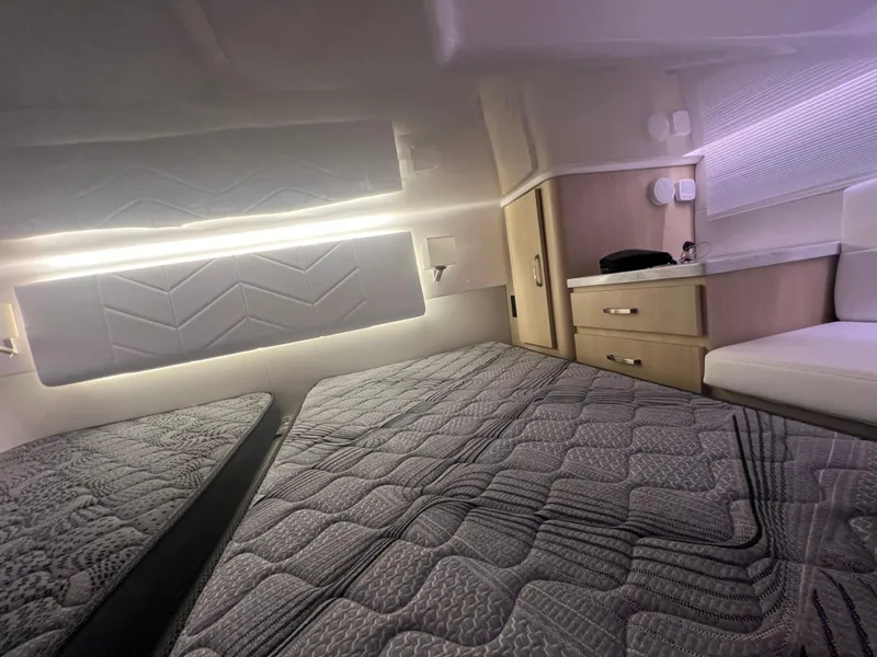 Slide: The Image of Luxurious interior cabin of 2023 Regal 38 XO yacht with modern bedding and ambient lighting. - 34