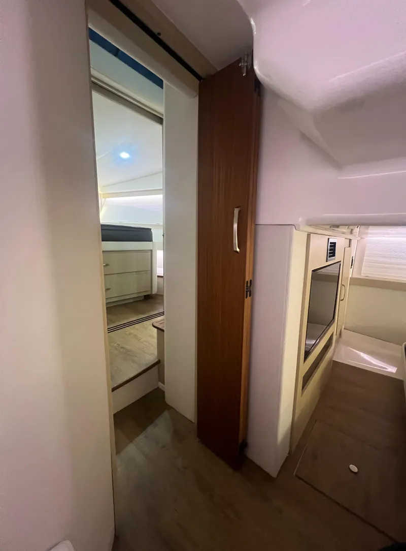 Slide: The Image of Interior of 2023 Regal 38 XO yacht, featuring modern design and wood accents. - 35