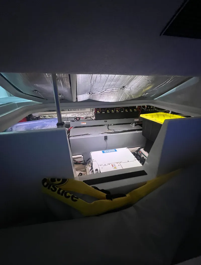 Slide: The Image of Interior view of 2023 Regal 38 XO boat engine compartment. - 37
