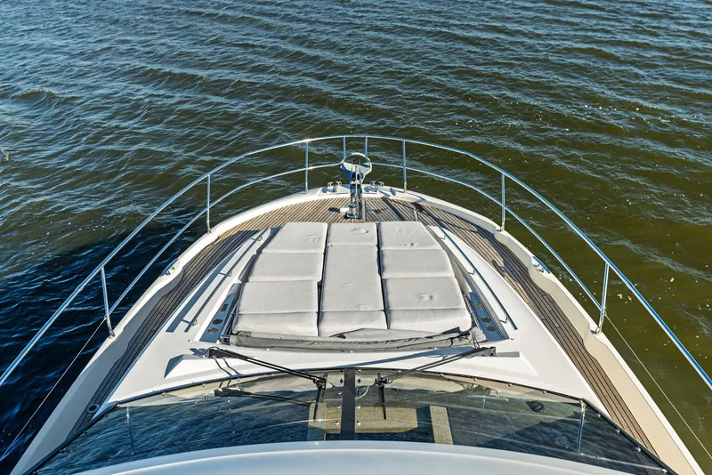 Slide: The Image of Prestige 520 Fly 2019 yacht bow view on open water. - 18