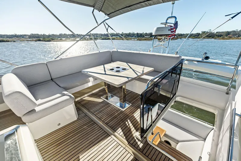 Slide: The Image of Luxurious 2019 Prestige 520 Fly yacht with spacious outdoor seating and scenic water view. - 25