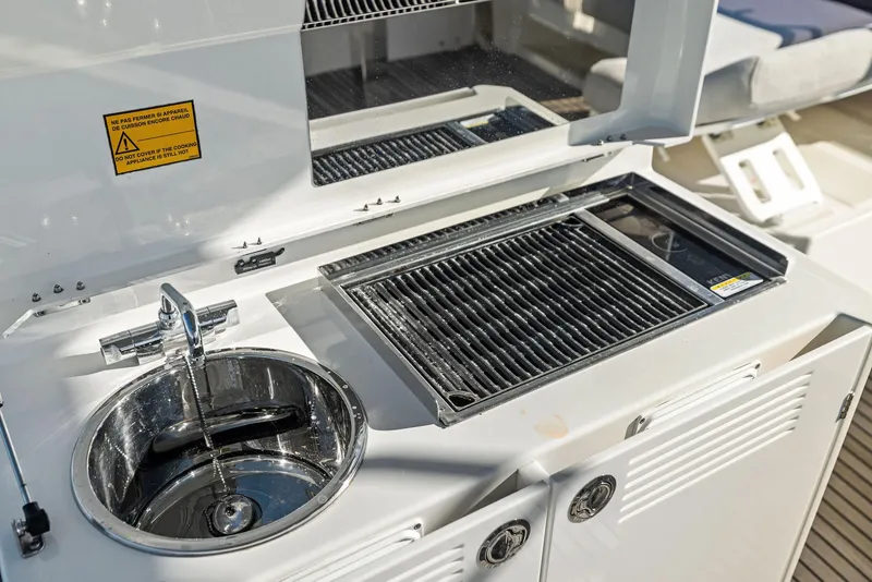 Slide: The Image of Outdoor kitchen on 2019 Prestige 520 Fly yacht with sink and grill. - 32