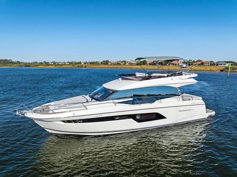 Slide: The Image of 2019 Prestige 520 Fly yacht cruising on a sunny day. - 4