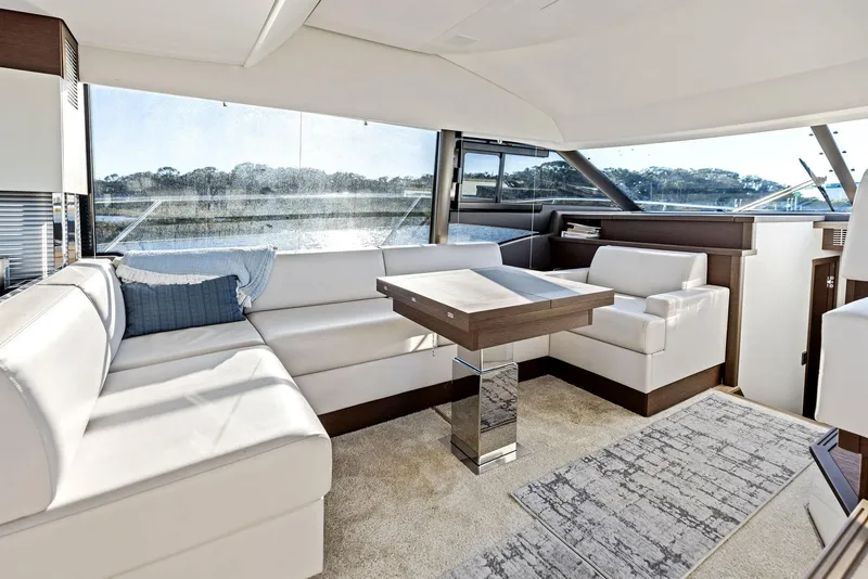 Slide: The Image of Luxurious interior of 2019 Prestige 520 Fly yacht with elegant seating and table. - 43