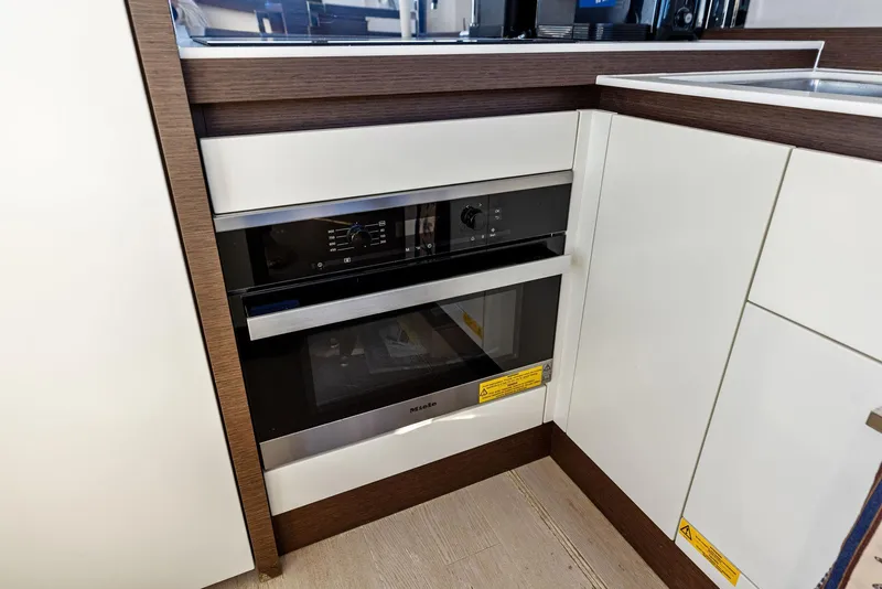 Slide: The Image of Modern kitchen appliances in 2019 Prestige 520 Fly yacht interior. - 46