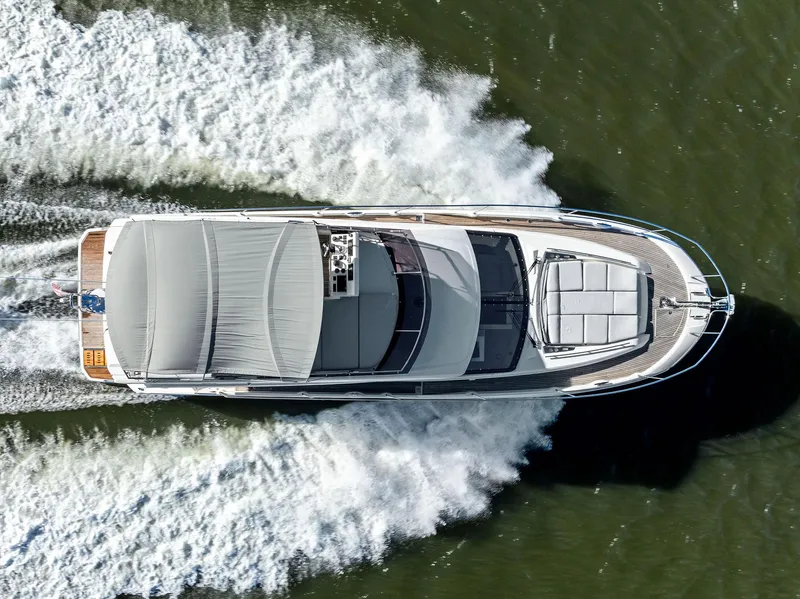 Slide: The Image of Aerial view of 2019 Prestige 520 Fly yacht cruising on water. - 9
