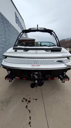 Slide: The Image of 2025 Monterey 224FS boat, rear view, displayed outdoors on concrete. - 15