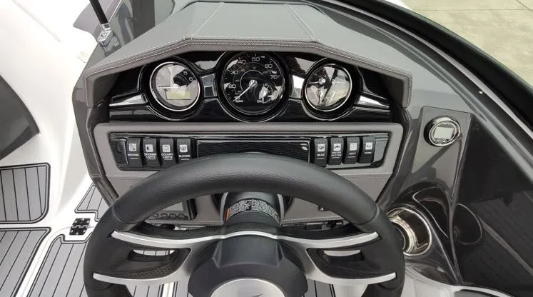 Slide: The Image of 2025 Monterey 224FS boat dashboard with steering wheel and control panel. - 8