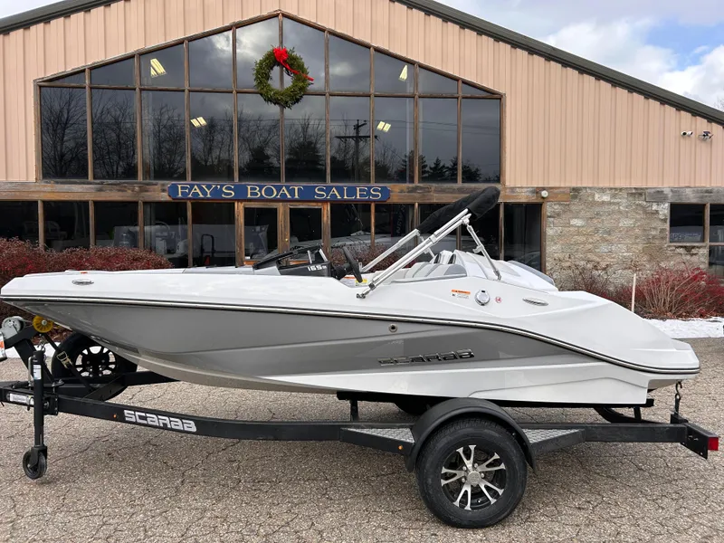 Slide: The Image of 2025 Scarab 165 SE boat on trailer outside Fay's Boat Sales. - 3