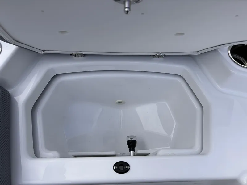Slide: The Image of Open storage compartment in 2025 Scarab 165 SE boat. - 30