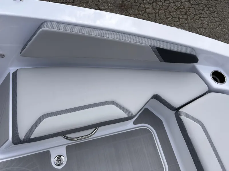 Slide: The Image of 2025 Scarab 165 SE boat interior seating with modern design and gray accents. - 31