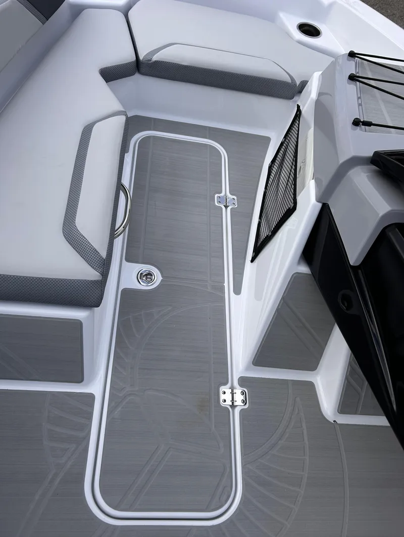 Slide: The Image of 2025 Scarab 165 SE boat interior with sleek seating and modern design. - 33