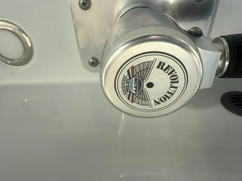 Slide: The Image of Close-up of a 2019 Cobia 301 Center Console boat control knob. - 10