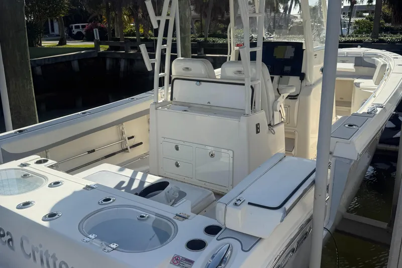 Slide: The Image of 2019 Cobia 301 Center Console boat with spacious seating and storage. - 14