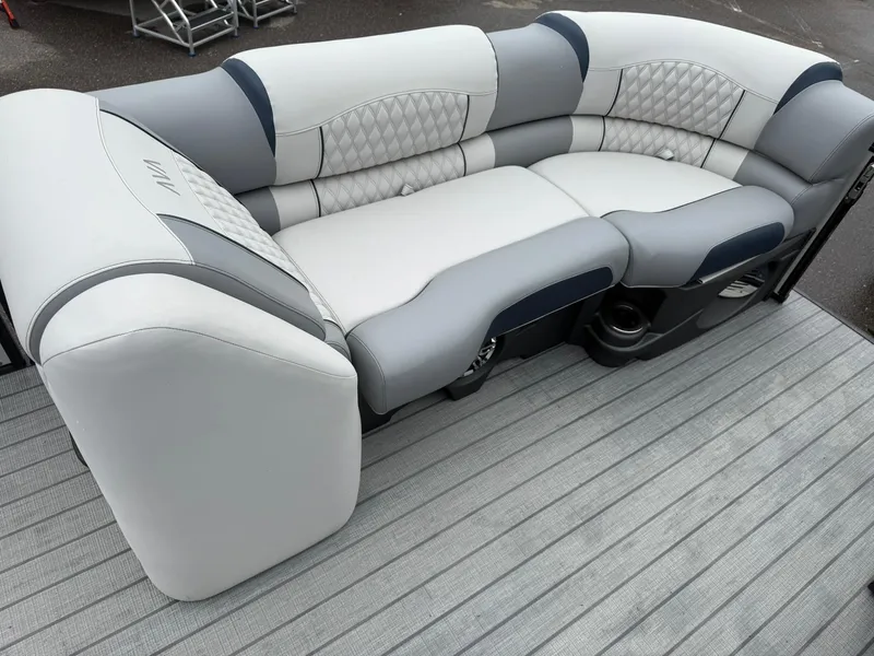 Slide: The Image of 2025 Avalon Catalina Quad Lounger Shift with luxurious gray and blue seating on a boat deck. - 21