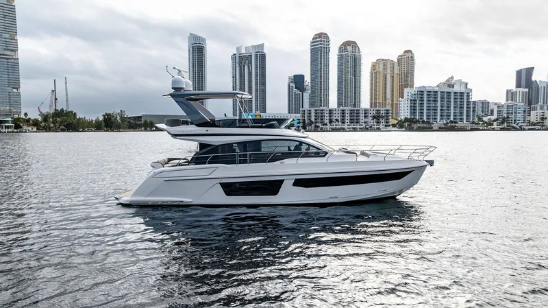 Slide: The Image of 2025 Azimut Fly 53 yacht cruising near city skyline. - 7