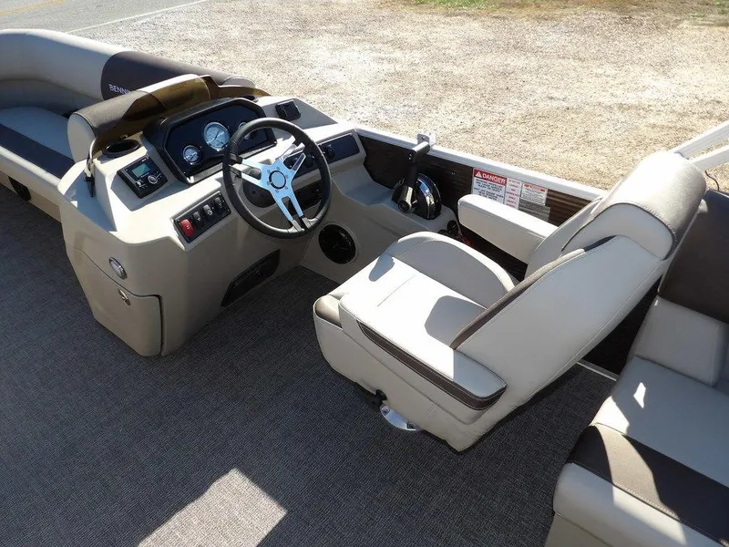 Slide: The Image of 2025 Bennington S Quad Bench 21 SSR boat interior with steering console and seating. - 20