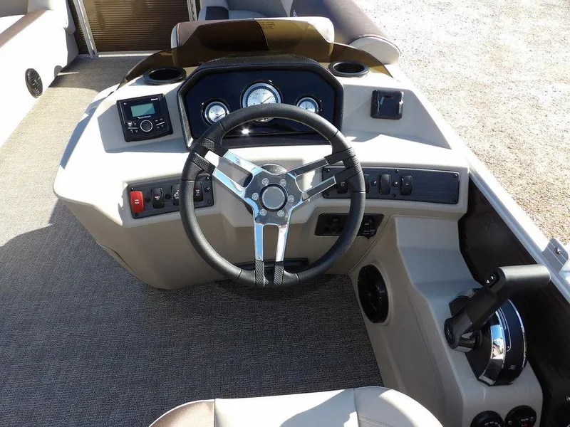 Slide: The Image of Steering console of 2025 Bennington S Quad Bench 21 SSR pontoon boat. - 21