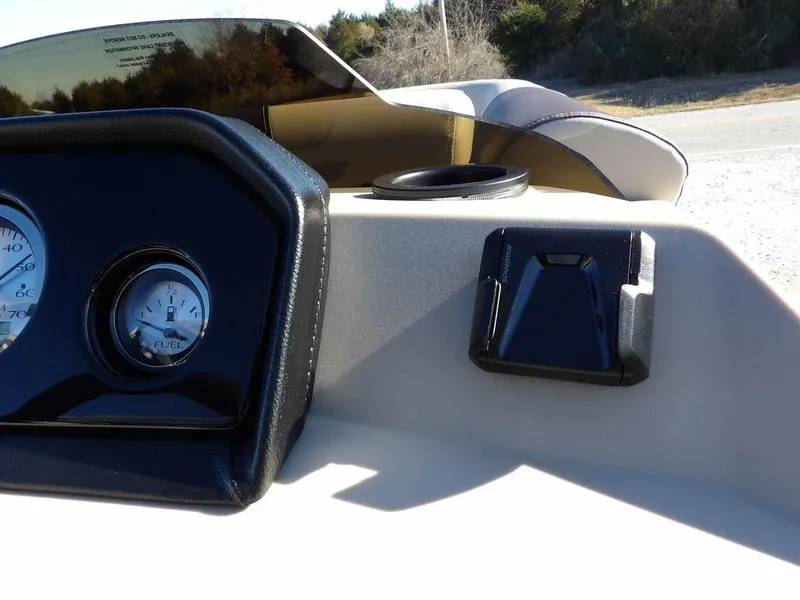 Slide: The Image of Dashboard of 2025 Bennington S Quad Bench 21 SSR boat with gauges and cup holder. - 23