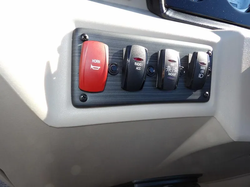 Slide: The Image of Control panel of 2025 Bennington S Quad Bench 21 SSR with horn and accessory switches. - 25