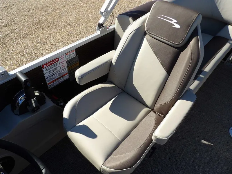 Slide: The Image of 2025 Bennington S Quad Bench 21 SSR captain's chair with armrests and sleek design. - 27