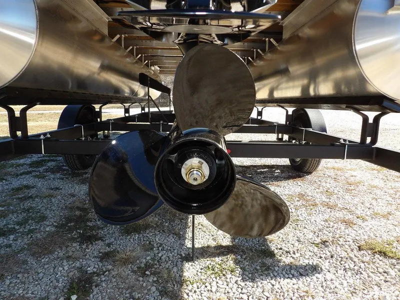 Slide: The Image of Propeller of 2025 Bennington S Quad Bench 21 SSR pontoon boat on trailer. - 41