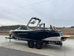 Slide: The Image of 2022 MasterCraft XT25 boat on trailer, parked outdoors. - 5