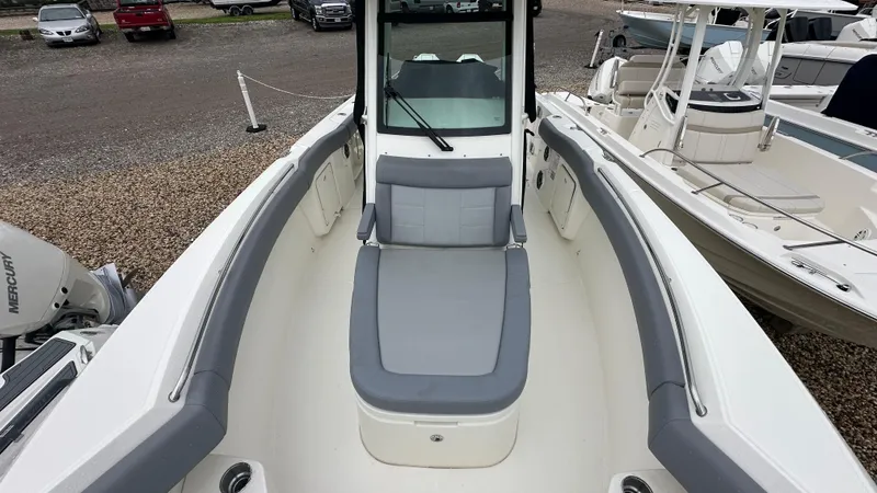 Slide: The Image of 2025 Boston Whaler 280 Outrage boat interior with cushioned seating and sleek design. - 30