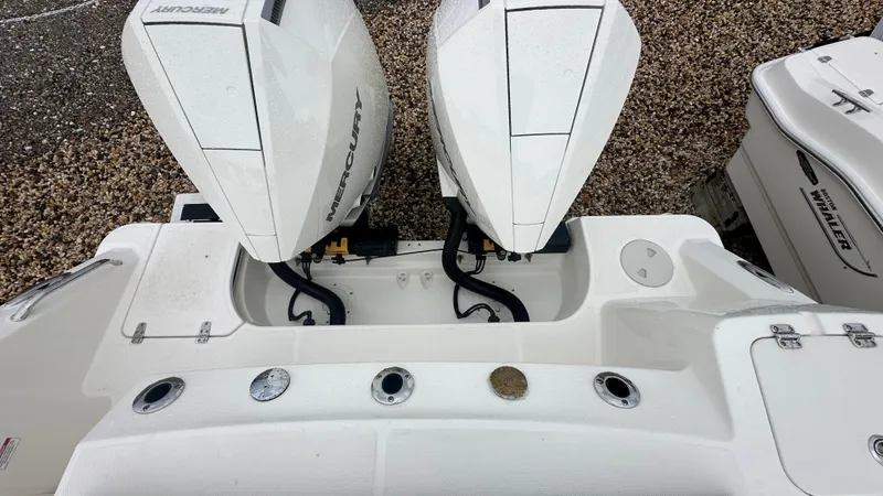 Slide: The Image of 2025 Boston Whaler 280 Outrage with dual Mercury outboard engines, viewed from above. - 5
