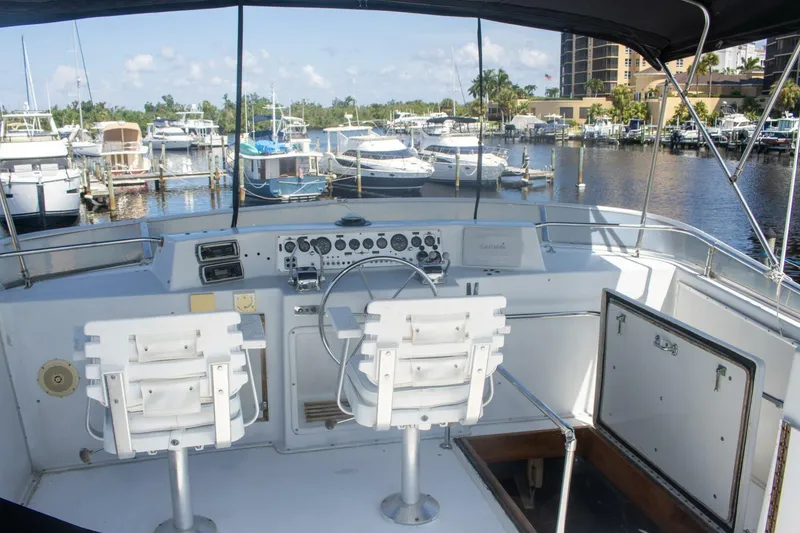 Slide: The Image of 1988 Chris-Craft 500 Constellation yacht helm with marina view. - 8