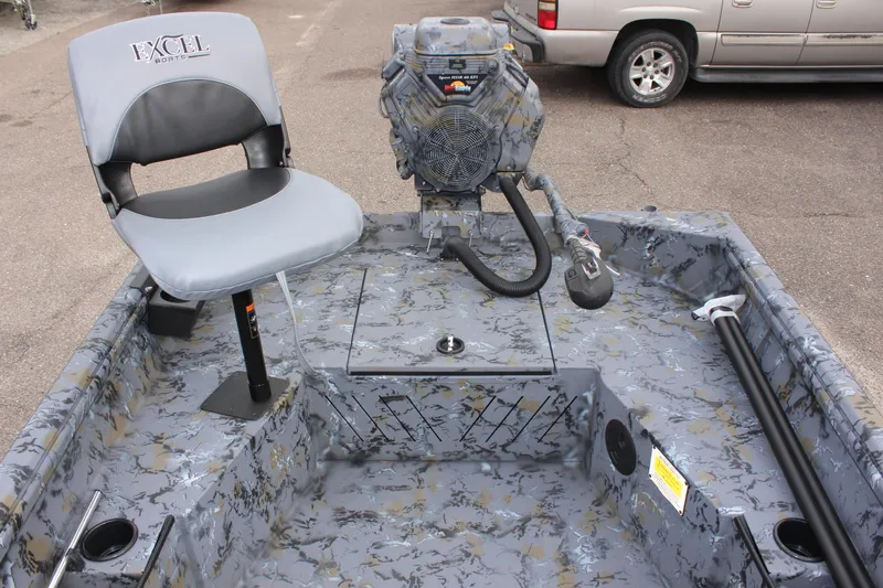 Slide: The Image of 2025 Excel Eclipse 1554 boat interior with camo design and seating. - 13