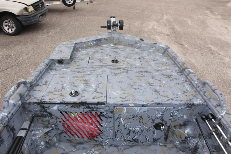 Slide: The Image of Excel Eclipse 1554 boat, 2025 model, with camo design and storage compartments. - 19