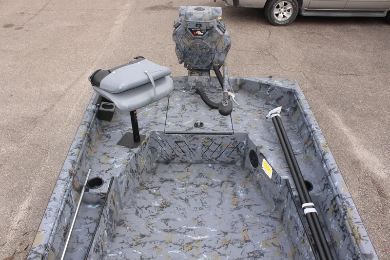 Slide: The Image of 2025 Excel Eclipse 1554 boat interior with camouflage design and seating. - 23